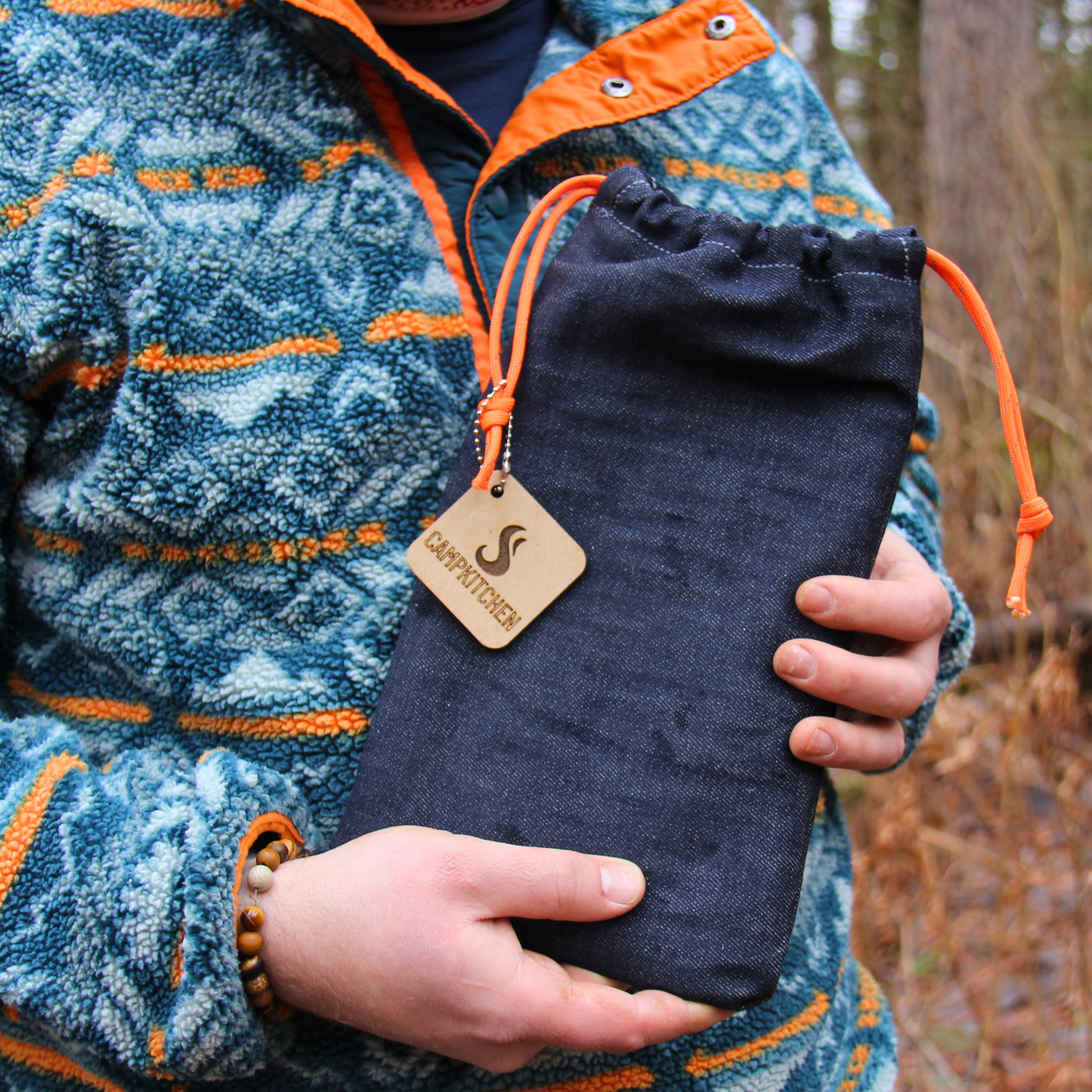 The CAMPKITCHEN Twig Stove denim bag. Hand stitched with paracord drawstring details.